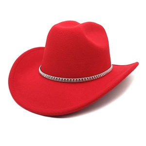 Detailed view of red wool felt cowboy hat featuring a sparkling silver rhinestone band