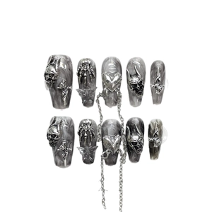 Handmade gothic press-on nails with silver metal skull, cross and heart motifs