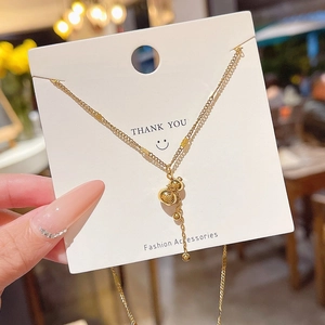 Collier en acier titane avec pendentif gourde et gravure de caractère Fu doré