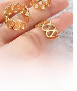 Detail of adjustable hollow heart gold ring showing intricate texture and open band design