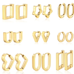 Collection of nine gold geometric hoop earrings in various shapes on a white background