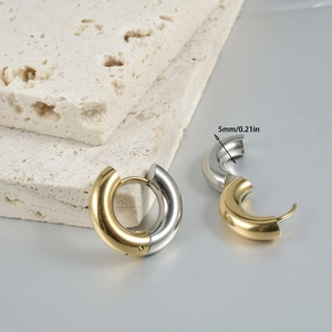 Detail view of two-tone stainless steel hoop earrings with 5mm thick tube diameter