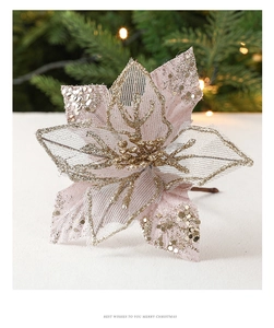 Detail of pink Christmas flower with golden glitter edges and shiny gold bead stamens