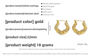 Detail of 18K gold-plated twisted hoop earrings with sparkling crystal rhinestones