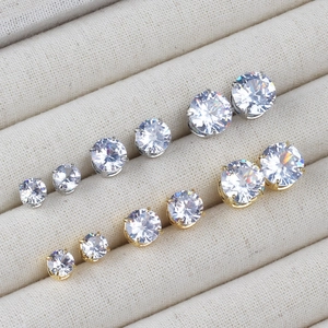 Macro shot of silver and gold plated cubic zirconia stud earrings set in five various sizes