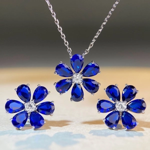 S925 sterling silver floral jewelry set with blue pear-cut sapphire pendant and earrings
