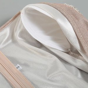 Detail of rose gold dress with built-in white chest pads and invisible zipper closure