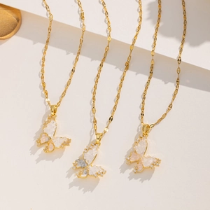Three elegant gold butterfly necklaces with translucent white stone texture and tiny zircons