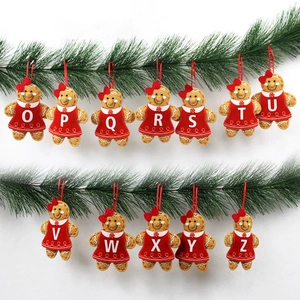 Christmas Gingerbread Man alphabet ornaments O-Z hanging on pine branches for decor
