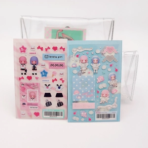 Detail of pink and blue anime girl dress-up sticker sets with PVC storage pouches