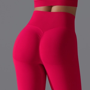 Detail of high waisted rose red yoga pants showing scrunch butt design and ribbed waistband
