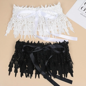 Detailed view of elegant lace waist belt with satin ribbon ties in black and white