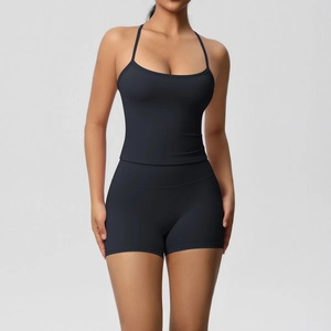 Detail of black sports set featuring a slim fit camisole and high waist gym shorts