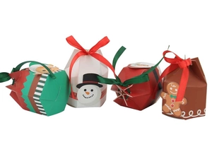 Detailed view of Christmas yurt candy boxes featuring festive snowman and gingerbread designs
