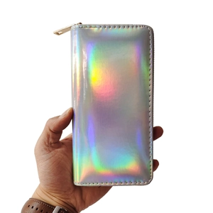 Holographic laser PU long wallet with rainbow reflection and gold zipper held by hand