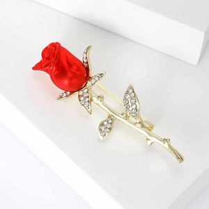 Luxurious red enamel rose brooch with gold finish and sparkling crystal accents