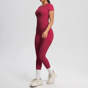 Detail view of red yoga set showing high-waisted leggings with side pocket and slim fit top