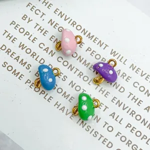 Set of four colorful 3D mushroom pendants in pink, purple, blue, and green for DIY jewelry