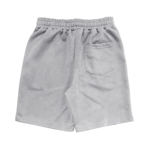 Détail du short en maille gris pour homme avec texture chevron, taille élastique et poche