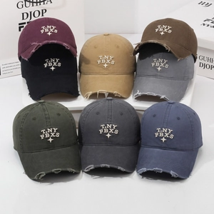 Distressed vintage baseball caps in multiple colors with T.NY FBXS embroidery details