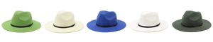Row of five colorful woven Panama hats in green, beige, blue and white on white background