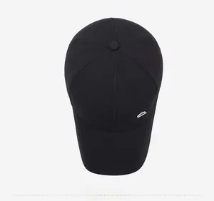 Close-up of black baseball cap with Fashion embroidery and silver metal logo detail
