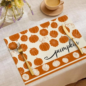 Detailed view of autumn pumpkin placemat with handwritten text on a cozy dining table