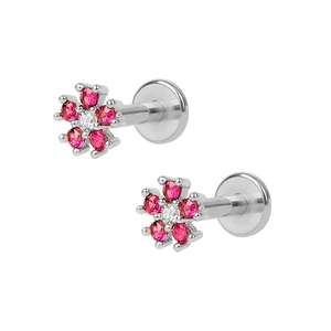 Macro detail of S925 silver snowflake labret studs with pink and clear cubic zirconia