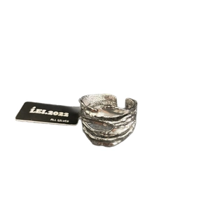 Irregular four-layer stacked S925 sterling silver open ring with molten lava texture