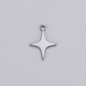 Macro detail of polished stainless steel four-pointed star pendant for DIY jewelry