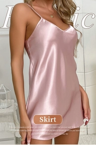 Detail of pink satin nightdress showing smooth silk texture and elegant V-neck design