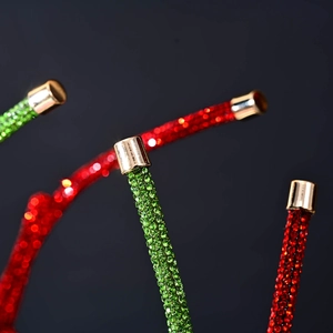 Macro shot of sparkling rhinestone strands with gold metal end caps for hair accessories