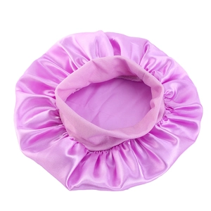 Detail view of purple satin hair bonnet showing the smooth texture and elastic wide band