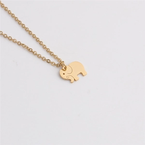 Macro view of a gold-plated elephant pendant with a classic O-chain on white background