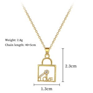 Detailed view of gold steel necklace showing 2.3cm x 1.3cm LOVE lock and key pendant