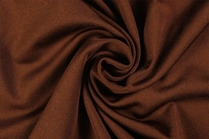Detail showing the deep brown ribbed knit fabric with elegant soft drape and texture