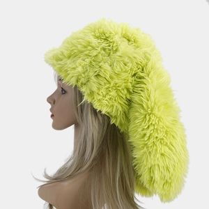 Side view of long fluorescent green plush trapper hat featuring fuzzy faux fur and long tail
