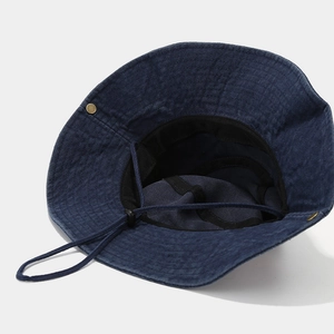 Navy blue wide brim bucket hat with adjustable windproof cord and metal rivet detail
