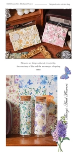 Close-up of vintage flower stationery including antique envelopes and glass sticker bottles