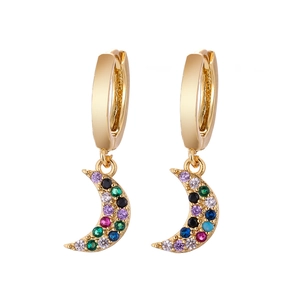 Macro shot of gold moon hoop earrings with colorful cubic zirconia starfield pave