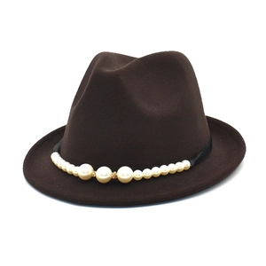 Detailed view of a dark brown wool fedora hat adorned with an elegant pearl band