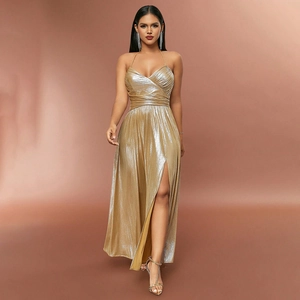 Close-up of metallic gold halter dress featuring waist pleats and a high slit detail