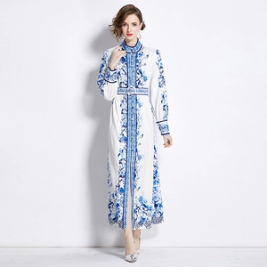 Elegant white maxi dress with blue floral print, stand collar and lace hem detail