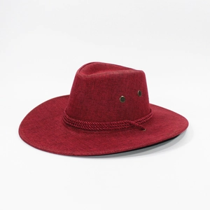 Detail of burgundy linen cowboy hat showing rope band and metal ventilation eyelets