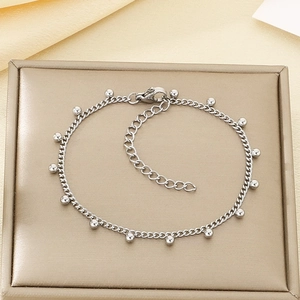 Minimalist silver stainless steel chain bracelet featuring small metal bead pendants