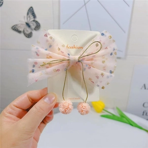 Barrette nœud en tulle rose avec paillettes colorées et pompons pour petites filles