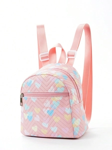 Pink mini quilted backpack with rainbow heart patterns and adjustable straps in studio view
