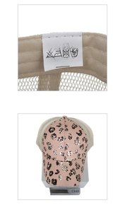 Detail of pink leopard ponytail cap showing material label and light weight of 82.4g