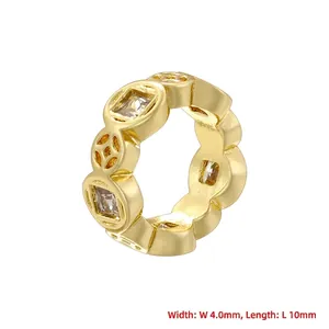 Macro shot of 4mm honeycomb coin bead with gold plating and square zircon inlay