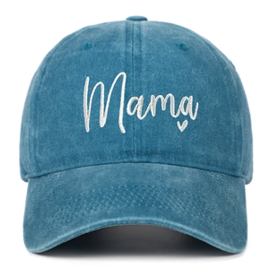 Close-up of white Mama embroidery and heart detail on blue washed cotton baseball cap